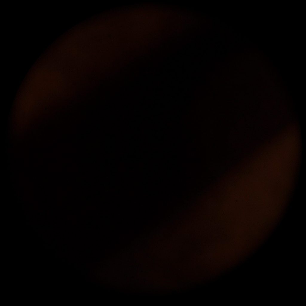 A dark circular composition with warm amber tones, suggesting connection and support